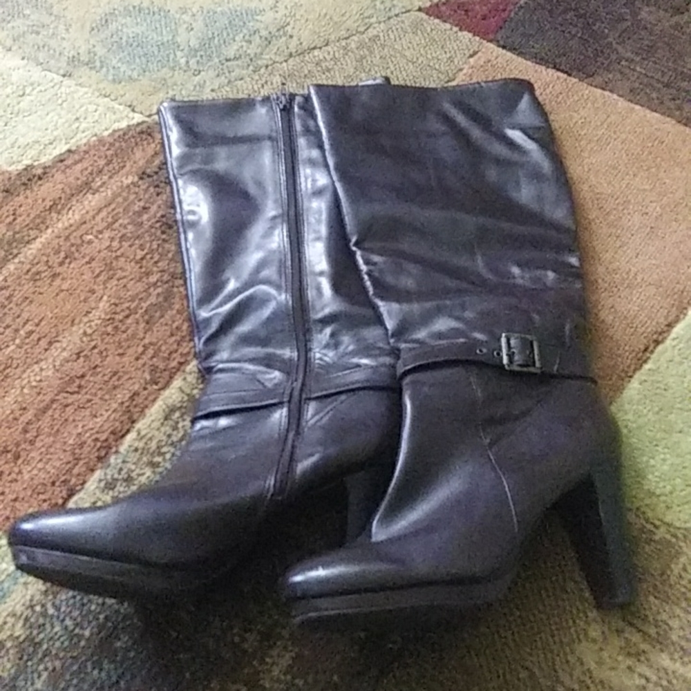 Brown high heel boots.